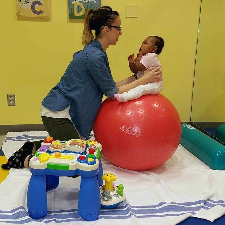 Image of baby receiving pediatric physical therapy Pediatrics Image