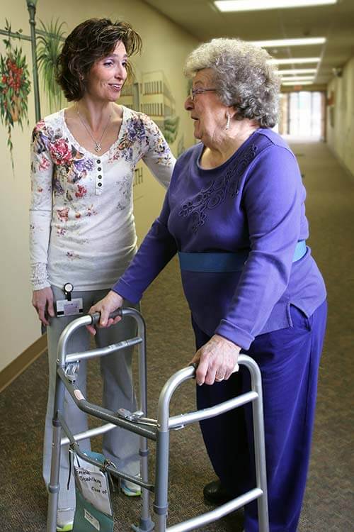 Image of caregiver and resident in nursing home Nursing Home Image