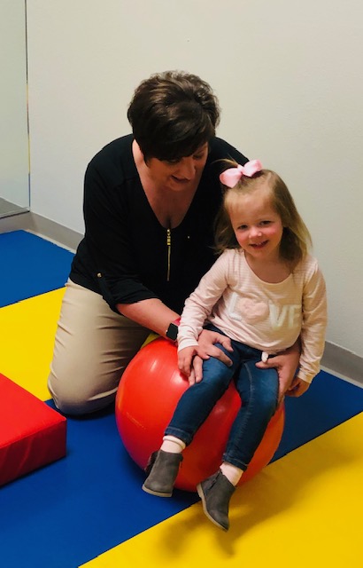 Image of Taylor Physical Therapy's therapist with peds patient Physical Therapist Kristin Kahler