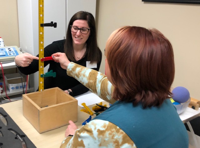 Image of Taylor Occupational Therapy Therapist using Ultra Sound on a patient's arm Nursing Home