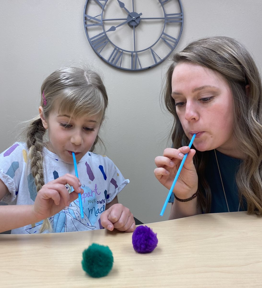 Image of Taylor Physical Therapy's therapist with a peds patient Physical Therapist Kristen Kahler