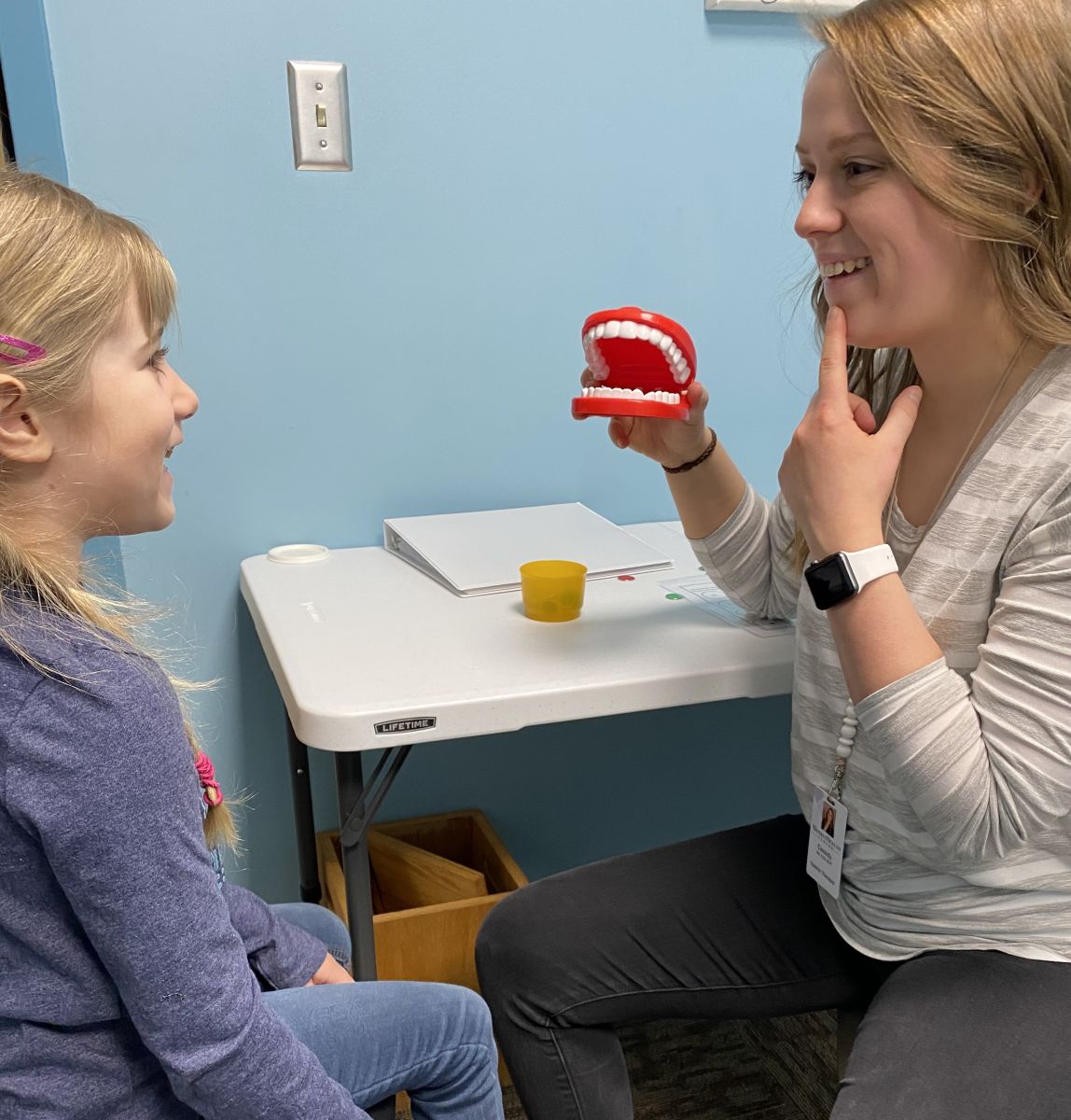 Image of Taylor Physical Therapy's therapist with peds patient Speech Therapist Kayla Berryman
