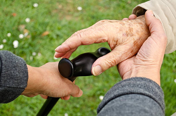 Handing a Cane to a patient Image